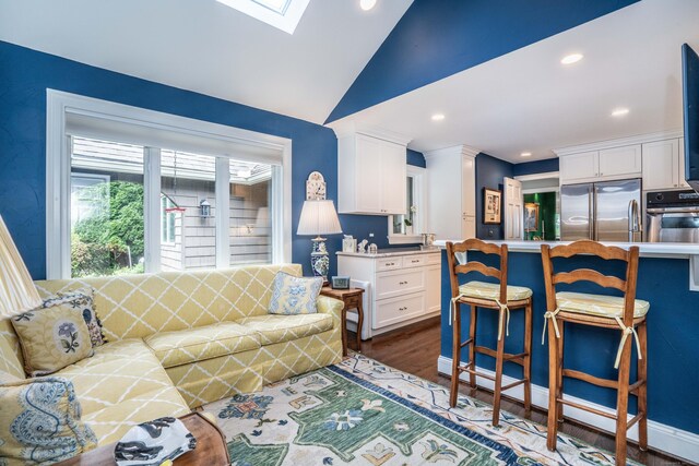 35 Saddle Rdg Unit 35, Bloomfield, CT 06002 - living room featuring vaulted ceiling, dark wood finished floors, recessed lighting, and a skylight