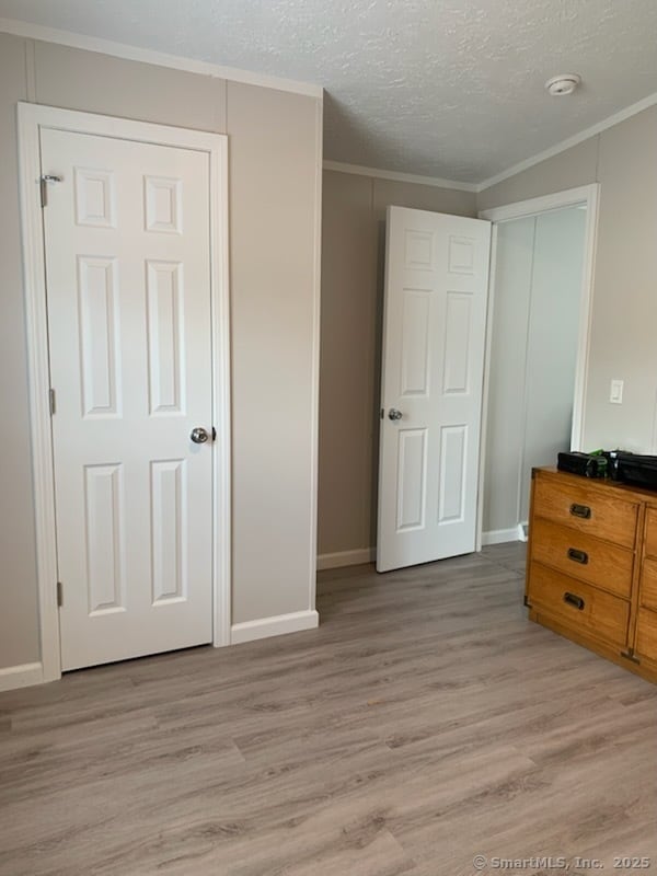 1012 Old Colony Rd Lot 8, Meriden, CT 06451 - unfurnished bedroom featuring light wood-type flooring, ornamental molding, and baseboards