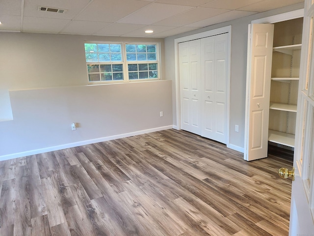 24 Wiscassett Ave, Hamden, CT 06518 - unfurnished bedroom featuring a drop ceiling, baseboards, wood finished floors, and a closet