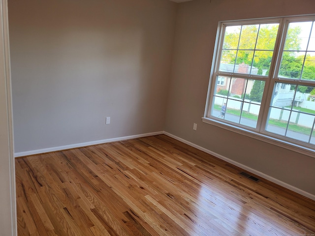 24 Wiscassett Ave, Hamden, CT 06518 - empty room featuring light wood-style flooring and baseboards
