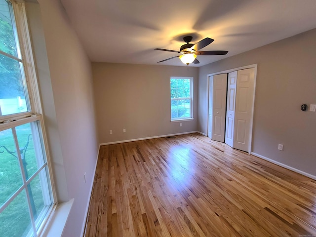24 Wiscassett Ave, Hamden, CT 06518 - unfurnished bedroom with wood finished floors, baseboards, a closet, and ceiling fan