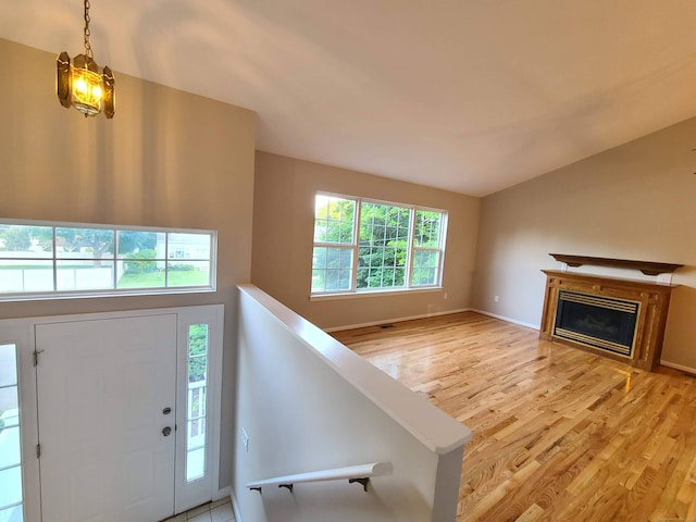 24 Wiscassett Ave, Hamden, CT 06518 - entrance foyer featuring light wood-style floors, a fireplace, and baseboards