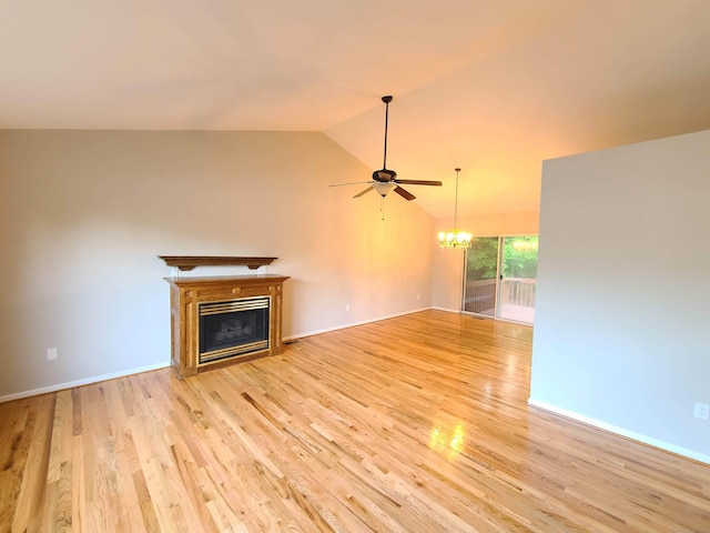24 Wiscassett Ave, Hamden, CT 06518 - unfurnished living room with a chandelier, a glass covered fireplace, vaulted ceiling, light wood-style flooring, and ceiling fan