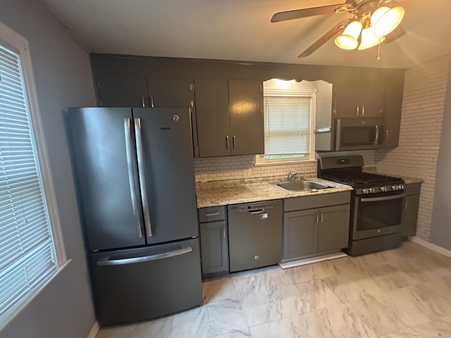 138 Radnor Ave, Naugatuck, CT 06770 - kitchen featuring appliances with stainless steel finishes, a sink, decorative backsplash, ceiling fan, and baseboards
