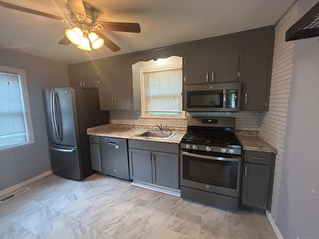 138 Radnor Ave, Naugatuck, CT 06770 - kitchen with stainless steel appliances, a sink, tasteful backsplash, baseboards, and a ceiling fan