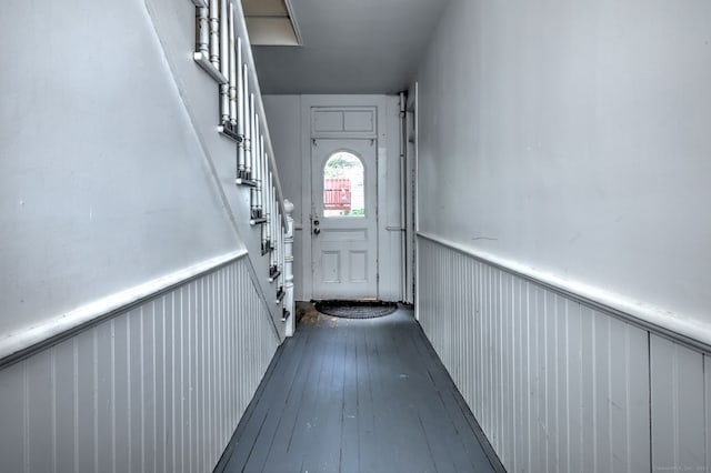 9 Woodland St, Vernon, CT 06066 - doorway to outside featuring wainscoting and dark wood-type flooring