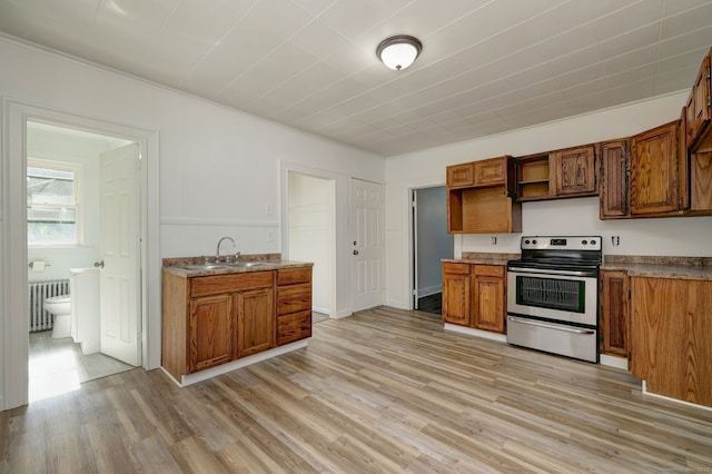 9 Woodland St, Vernon, CT 06066 - kitchen with stainless steel range with electric stovetop, radiator heating unit, light wood-style floors, brown cabinets, and ornamental molding