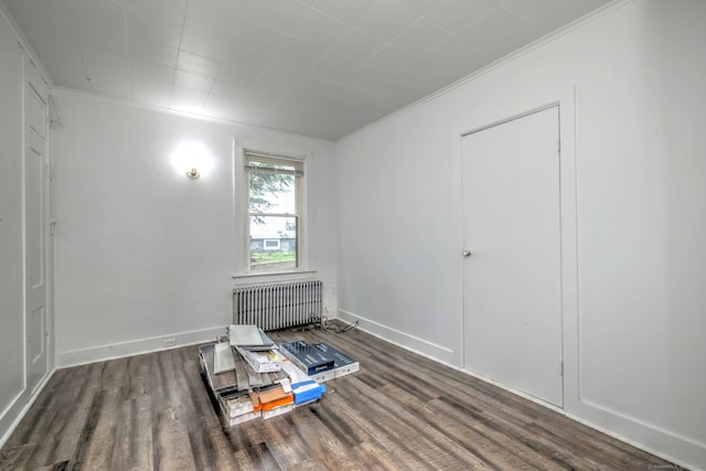 9 Woodland St, Vernon, CT 06066 - bedroom featuring radiator heating unit, wood finished floors, and crown molding