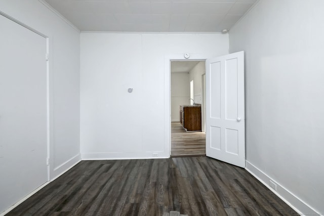 9 Woodland St, Vernon, CT 06066 - spare room featuring dark wood finished floors and crown molding