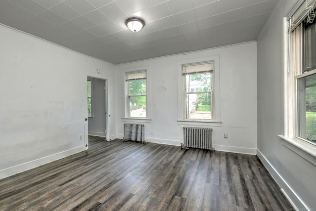 9 Woodland St, Vernon, CT 06066 - unfurnished room featuring radiator and dark wood-style floors