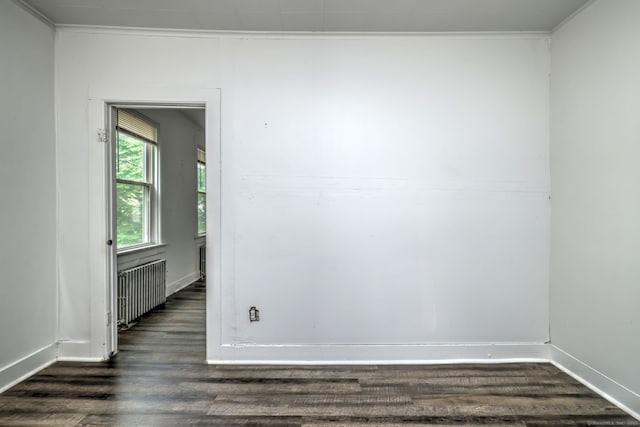 9 Woodland St, Vernon, CT 06066 - empty room with radiator and dark wood finished floors