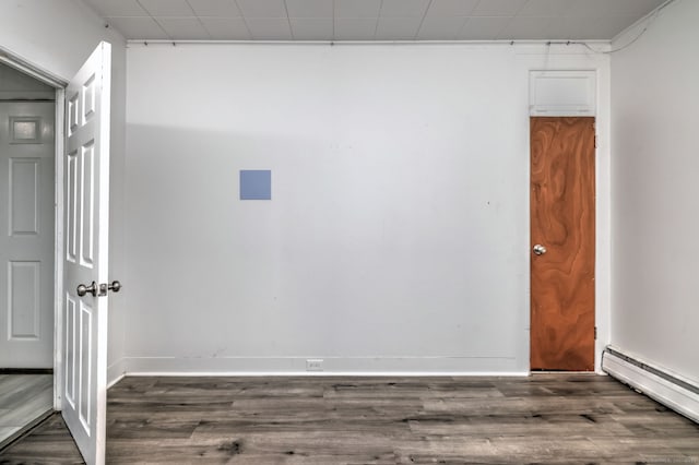 9 Woodland St, Vernon, CT 06066 - empty room with baseboard heating and wood finished floors