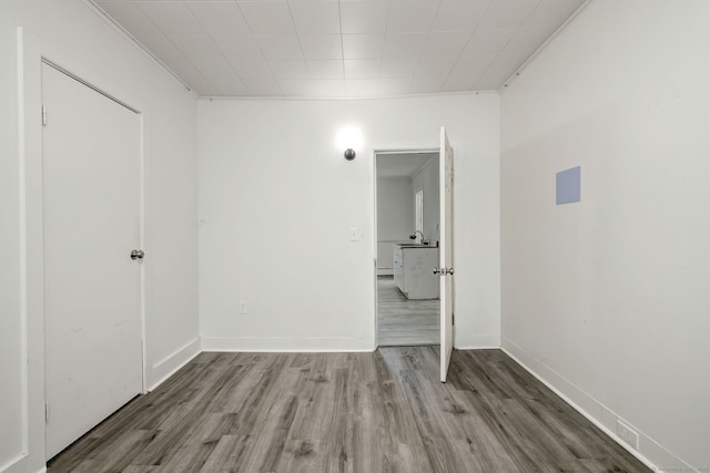 9 Woodland St, Vernon, CT 06066 - unfurnished room featuring wood finished floors and a sink