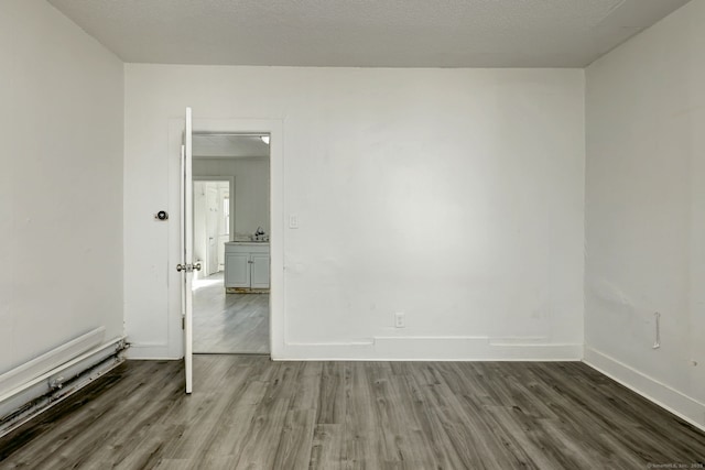 9 Woodland St, Vernon, CT 06066 - spare room featuring wood finished floors and baseboards