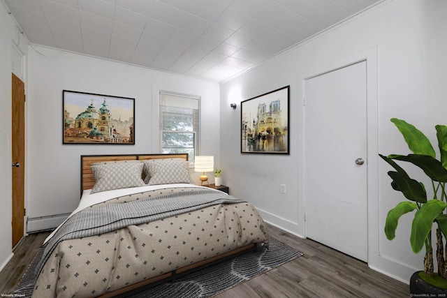 9 Woodland St, Vernon, CT 06066 - bedroom with wood finished floors, baseboard heating, and ornamental molding