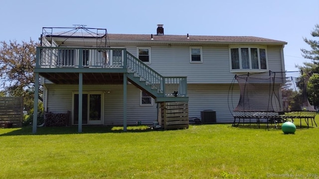 71 Sentinel Hill Rd, North Haven, CT 06473 - rear view of house with stairway, a lawn, a trampoline, a gazebo, and a wooden deck