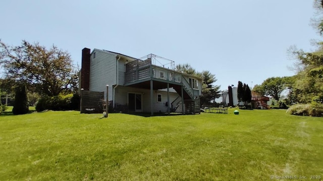 71 Sentinel Hill Rd, North Haven, CT 06473 - rear view of property with stairs, a wooden deck, a yard, and a chimney