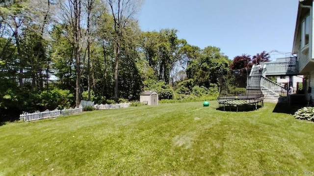 71 Sentinel Hill Rd, North Haven, CT 06473 - view of yard featuring a shed, stairs, and a trampoline