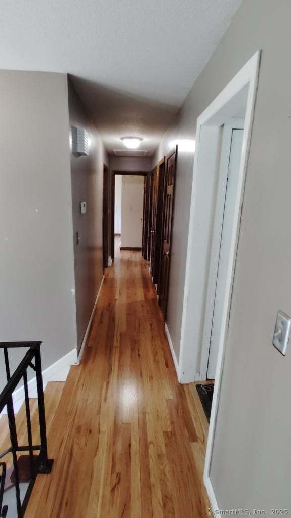71 Sentinel Hill Rd, North Haven, CT 06473 - hallway with light wood-style floors and baseboards