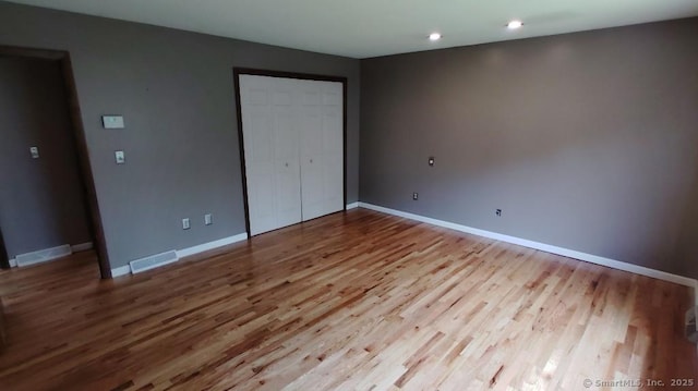 71 Sentinel Hill Rd, North Haven, CT 06473 - unfurnished bedroom with wood finished floors, recessed lighting, and a closet