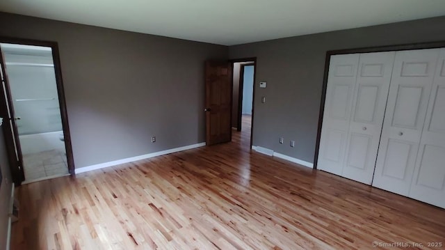 71 Sentinel Hill Rd, North Haven, CT 06473 - unfurnished bedroom with light wood-type flooring and a closet