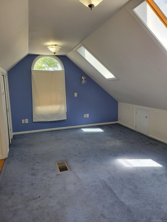 26 King St, Shelton, CT 06484 - additional living space with a skylight, carpet flooring, vaulted ceiling, and baseboards