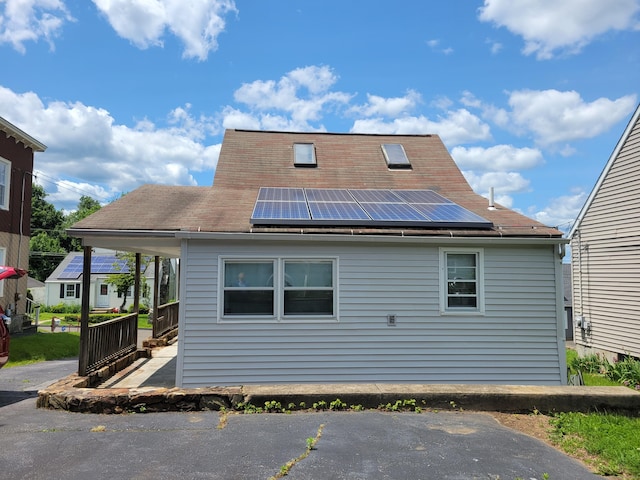 26 King St, Shelton, CT 06484 - rear view of property with roof mounted solar panels and roof with shingles