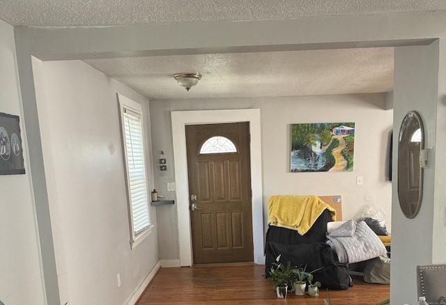 52 Platt St, Bridgeport, CT 06606 - entrance foyer with wood finished floors, a textured ceiling, and baseboards