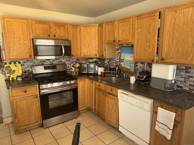 52 Platt St, Bridgeport, CT 06606 - kitchen featuring appliances with stainless steel finishes, a sink, and tasteful backsplash