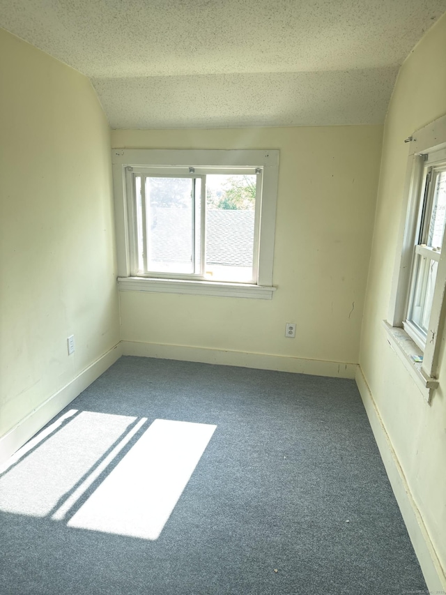 52 Platt St, Bridgeport, CT 06606 - carpeted spare room featuring a textured ceiling, baseboards, and lofted ceiling