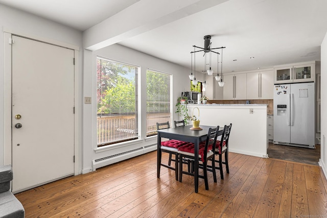 3 Clemens Ct Unit 3, Rocky Hill, CT 06067 - dining room featuring a baseboard radiator and wood-type flooring