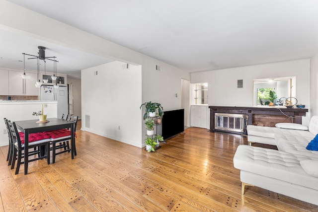 3 Clemens Ct Unit 3, Rocky Hill, CT 06067 - living area with light wood-style flooring, a ceiling fan, and baseboards