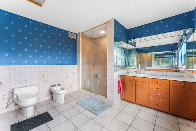 3 Clemens Ct Unit 3, Rocky Hill, CT 06067 - bathroom with wallpapered walls, toilet, a shower stall, vanity, and a bidet