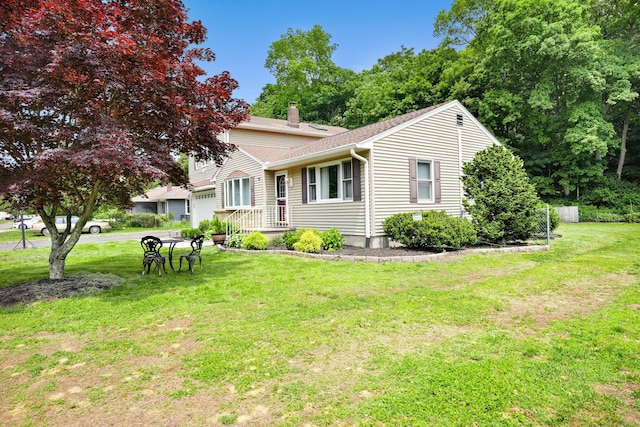 8 Palmer Ln, Oxford, CT 06478 - view of front of home featuring a chimney, an attached garage, a front yard, and a shingled roof
