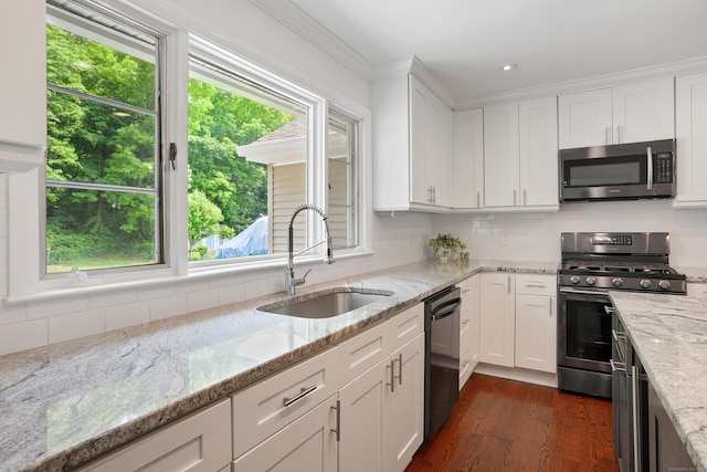 8 Palmer Ln, Oxford, CT 06478 - kitchen with stainless steel appliances, dark wood finished floors, white cabinetry, decorative backsplash, and light stone countertops