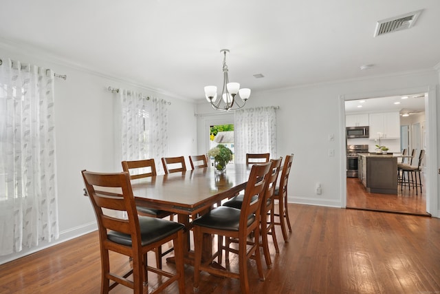 8 Palmer Ln, Oxford, CT 06478 - dining space with a chandelier, wood finished floors, and ornamental molding