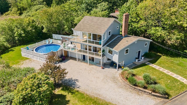 49 Economy Dr, Westbrook, CT 06498 - view of subject property featuring a pool area and a forest