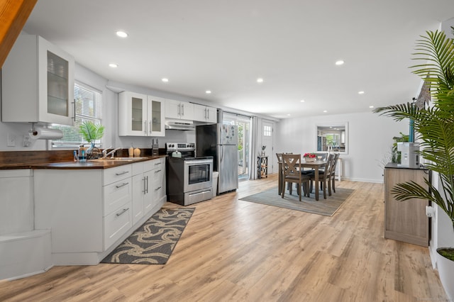 49 Economy Dr, Westbrook, CT 06498 - kitchen with stainless steel appliances, light wood-type flooring, recessed lighting, under cabinet range hood, and healthy amount of natural light