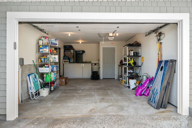 49 Economy Dr, Westbrook, CT 06498 - garage featuring a garage door opener