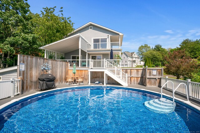 49 Economy Dr, Westbrook, CT 06498 - view of pool featuring grilling area, stairway, and a wooden deck
