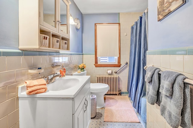 103 Mount Pleasant St, Derby, CT 06418 - bathroom featuring radiator heating unit, a shower with curtain, vanity, tile walls, and wainscoting