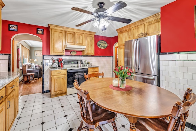 103 Mount Pleasant St, Derby, CT 06418 - kitchen with range with electric stovetop, freestanding refrigerator, under cabinet range hood, arched walkways, and ceiling fan