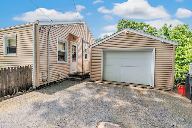 103 Mount Pleasant St, Derby, CT 06418 - view of front facade featuring an outdoor structure, asphalt driveway, and a garage