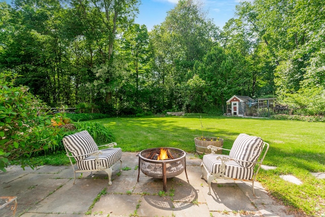 17 Joanne Ln, Weston, CT 06883 - view of patio with an outdoor fire pit and an outbuilding