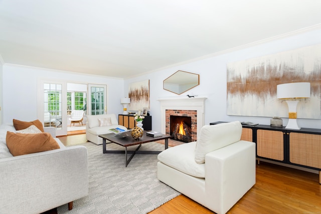 17 Joanne Ln, Weston, CT 06883 - living area featuring ornamental molding, light wood-style floors, and a brick fireplace