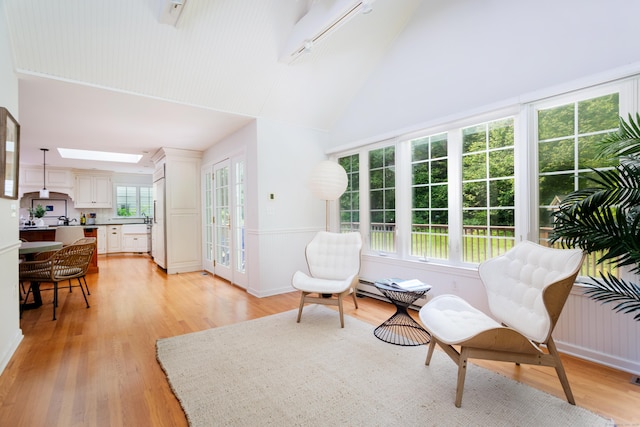 17 Joanne Ln, Weston, CT 06883 - living area with light wood-style floors, a baseboard heating unit, high vaulted ceiling, and baseboards