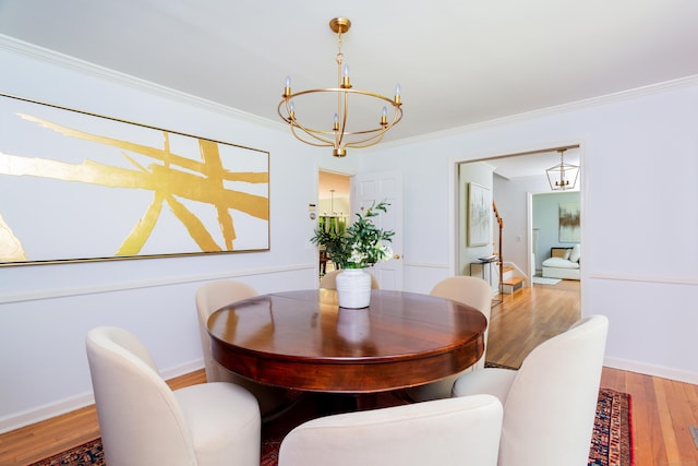 17 Joanne Ln, Weston, CT 06883 - dining area with a chandelier, wood finished floors, crown molding, and baseboards