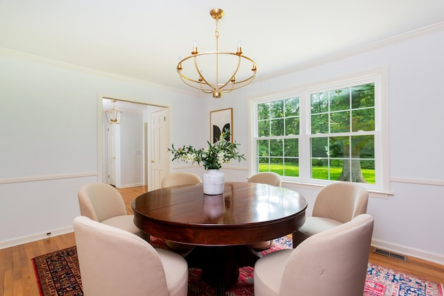 17 Joanne Ln, Weston, CT 06883 - dining space with a chandelier, wood finished floors, crown molding, and baseboards
