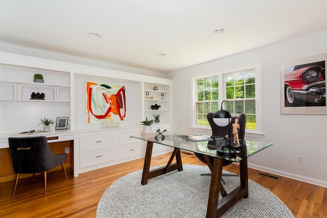 17 Joanne Ln, Weston, CT 06883 - home office with light wood-style flooring, built in desk, and baseboards