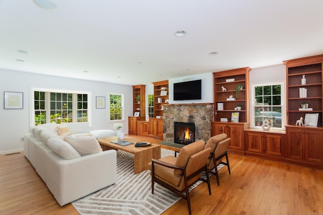 17 Joanne Ln, Weston, CT 06883 - living area with a fireplace, light wood-style flooring, recessed lighting, and baseboards